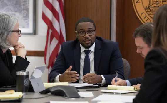 Public Administrators in a City Meeting
